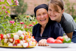 smiling elderly woman and daughter local home health care agency